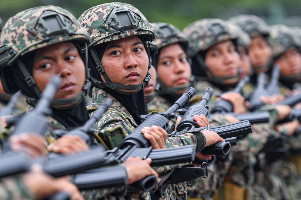 Female soldiers performing a march-past in front of the Chief of Army, General Tan Sri Muhammad Hafizuddeain Jantan, during the Passing Out Parade of the 201st Series Male Young Soldiers and 49th Series Female Soldiers of 2024 at the Parade Ground of the Army Basic Training Center in Port Dickson. — Bernama pic
