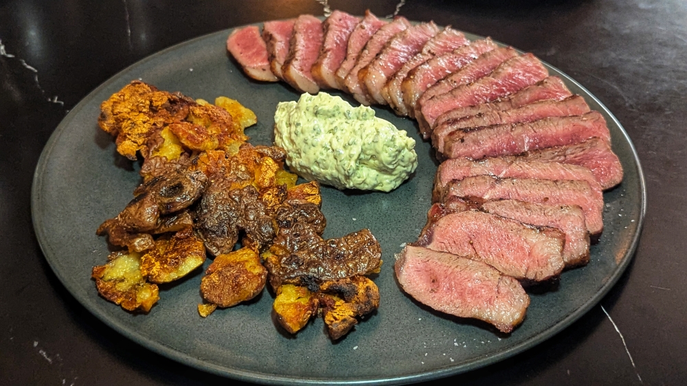 The grilled sirloin steak comes with chimichurri butter and crispy baby potatoes.