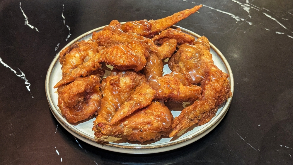 A classic bar snack, Juno’s fried chicken sports a thick and sticky Guinness caramel.