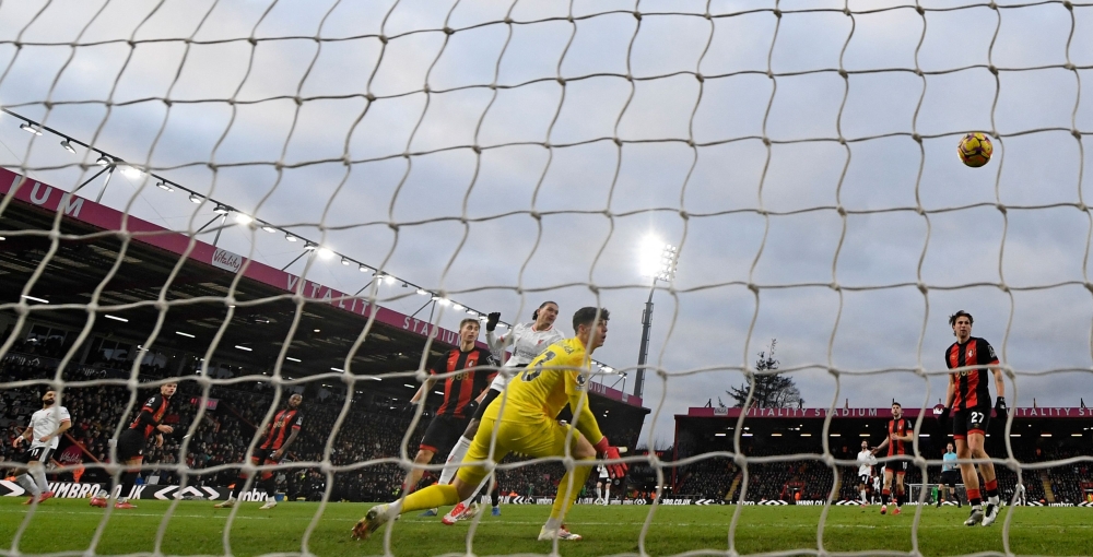 Liverpool’s  Mohamed Salah (left) watches his shot beat Bournemouth’s goalkeeper Kepa Arrizabalaga for their second goal. — PIc by AFP 