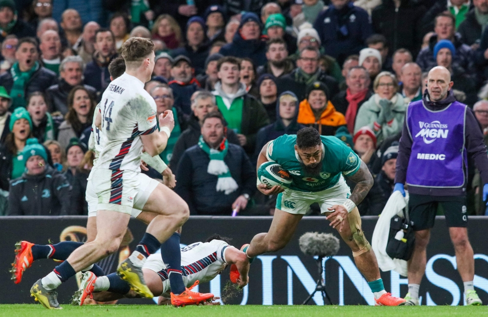 Ireland's centre Bundee Aki scores a try during the Six Nations international rugby union match between Ireland and England at the Aviva Stadium in Dublin, on February 1. — AFP pic