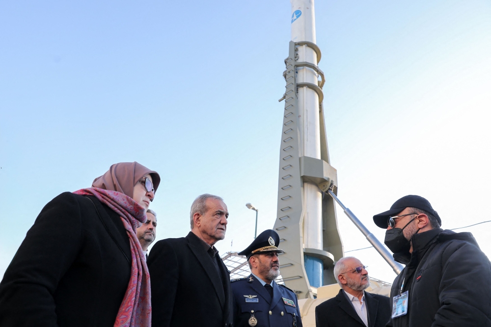 President Masoud Pezeshkian (centre) visits a defence and space achievements exhibition in Tehran. — Pic by AFP