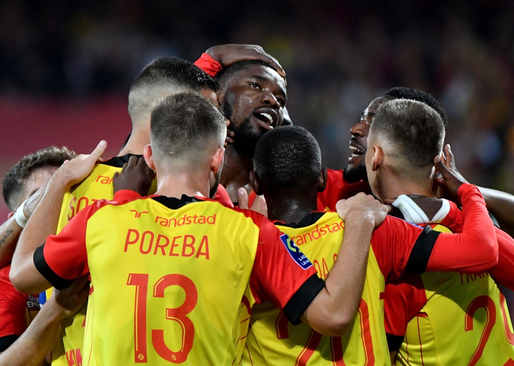 Lens' Austrian defender Kevin Danso (centre) celebrates with teammates after scoring against Troyes at Stade Bollaert-Delelis in Lens September 9, 2022. — Reuters pic 