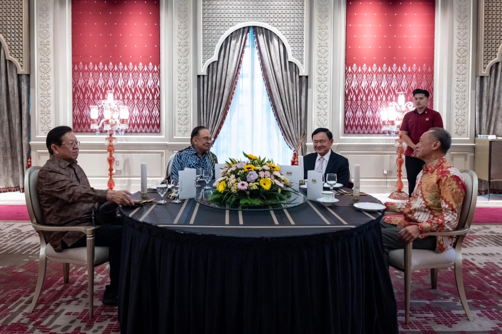 Anwar (second from left) and Thaksin (second from right) held a discussion about neighbouring Myanmar and cryptocurrencies on February 2, 2025. — Picture from Facebook/Anwar Ibrahim