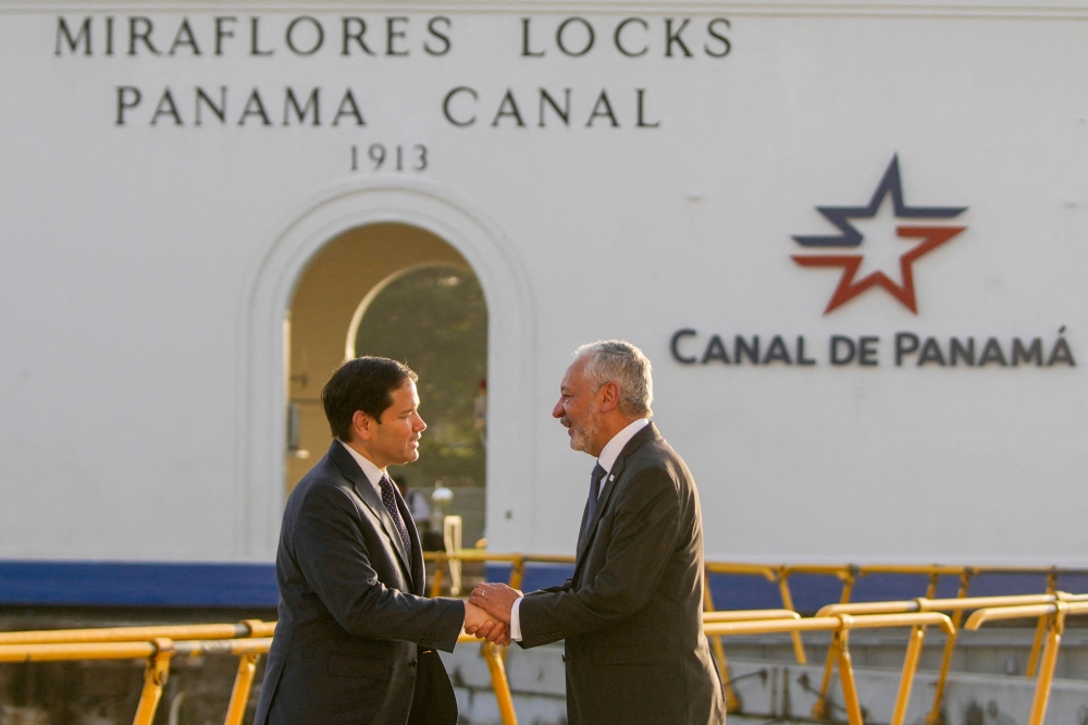 US Secretary of State Marco Rubio (L) shakes hands with Panama Canal Authority Administrator Ricaurte Vasquez during a tour at the Miraflores locks of the Panama Canal in Panama City on February 2, 2025. — AFP pool pic