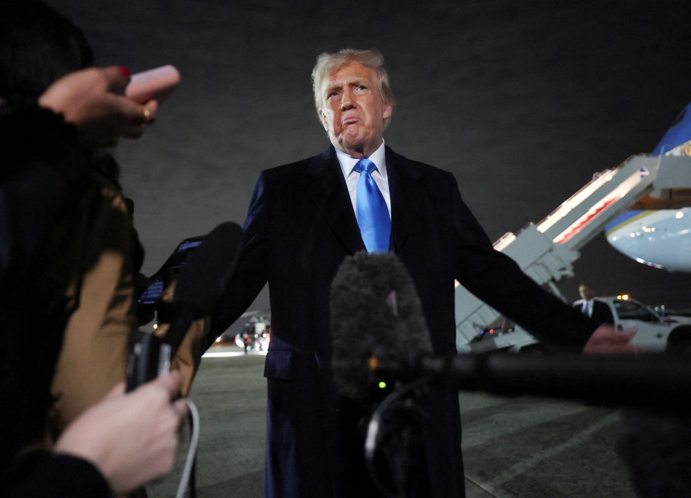 US President Donald Trump speaks to reporters after stepping from Air Force One upon his return to Washington, at Joint Base Andrews in Maryland, US, February 2, 2025. — Reuters pic