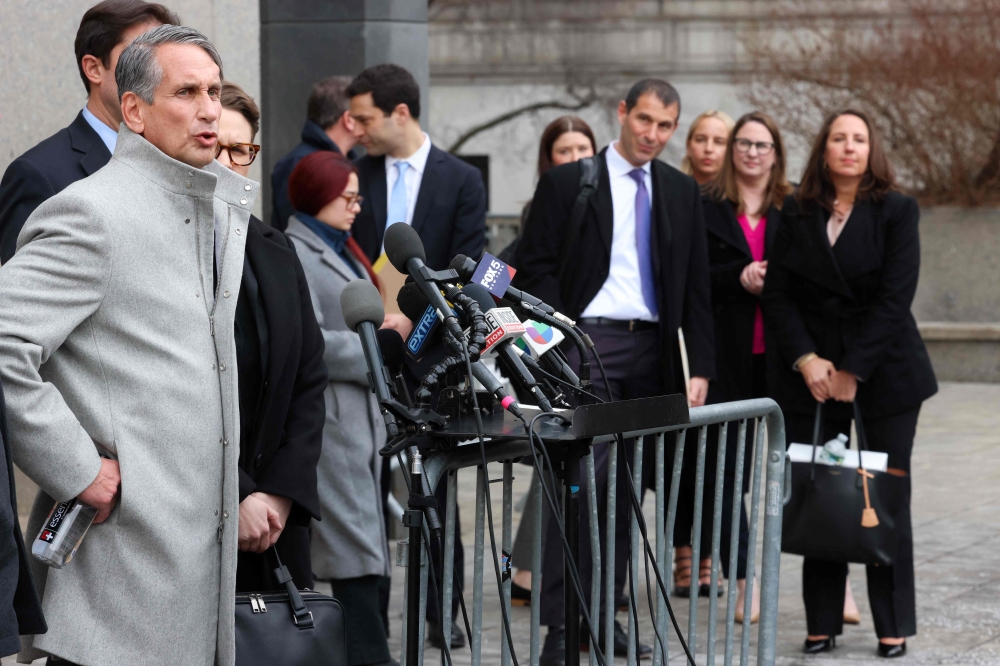 Actor and director Justin Baldoni’s lead counsel, Bryan Freedman, speaks to the press at US District Court after a pre-trial hearing — as Blake Lively’s lawyers Michael Gottlieb (centre) and Ezra Hudson (right) look on. — Pic by AFP