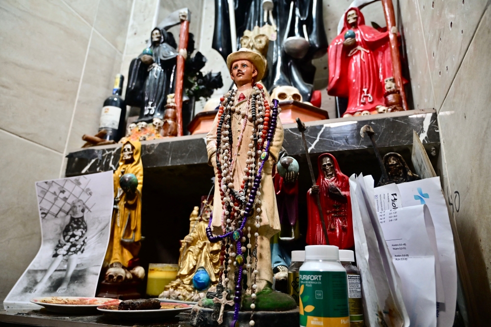 An altar with Santa Muerte is pictured inside a luxury house during a joint armed forces and national police operation in Duran. — Pic by AFP