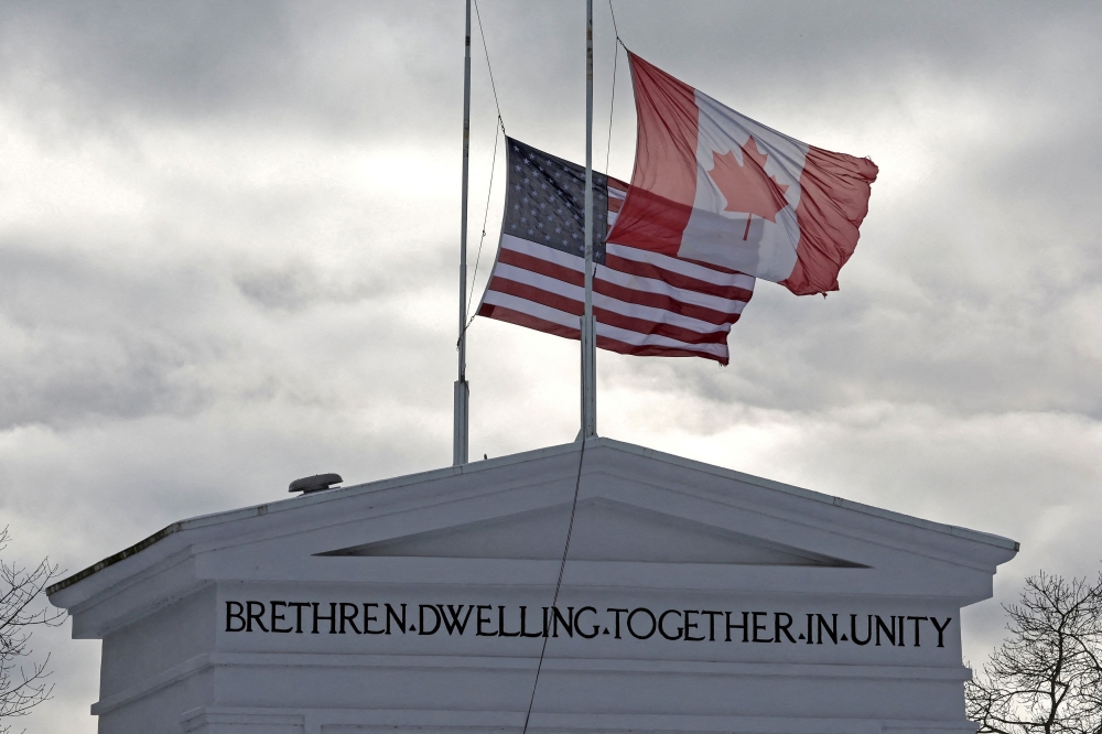 Flags of Canada and the United States flutter over the Peace Arch monument marking the border between the two countries, in Surrey, British Columbia, Canada February 3, 2025. — Reuters pic