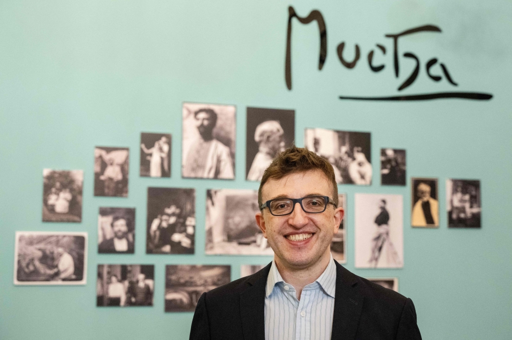 Marcus Mucha, grandson of of Art Nouveau painter Alfons Mucha poses for photo during an AFP interview in the Prague's new museum dedicated his granddad. — AFP pic