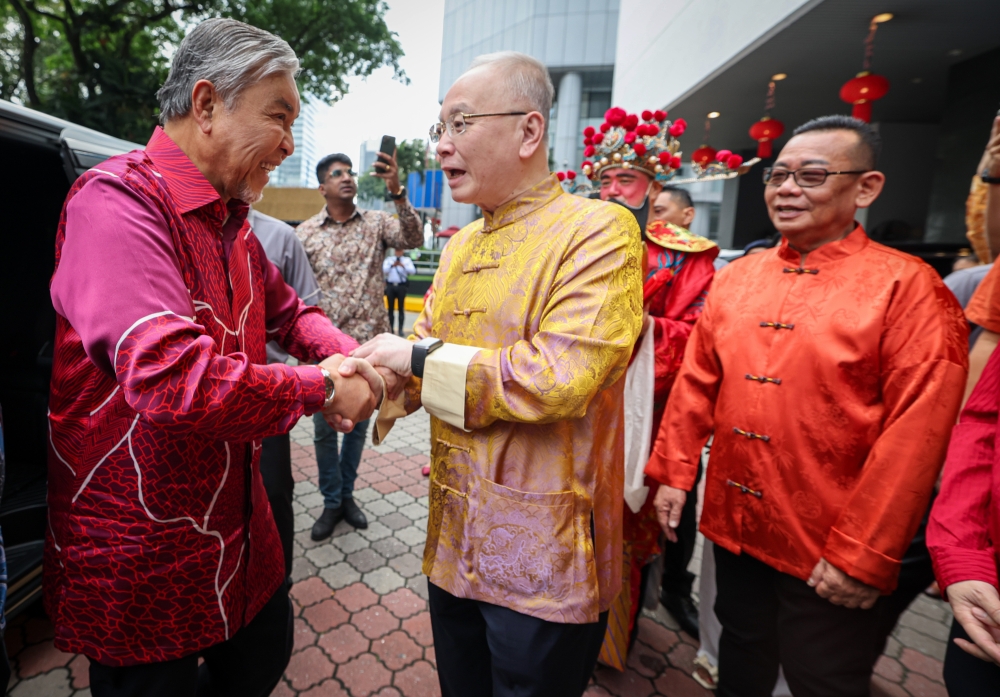 Deputy Prime Minister Datuk Seri Ahmad Zahid Hamidi shakes hands with MCA president Datuk Seri Wee Ka Siong at the MCA Chinese New Year Open House in Kuala Lumpur January 29, 2025. — Bernama