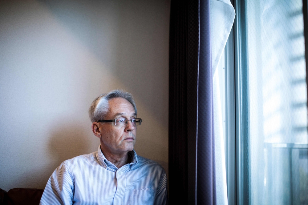 This file picture taken on February 6, 2020 shows former Nissan executive Greg Kelly posing at his apartment in Tokyo. — AFP pic 