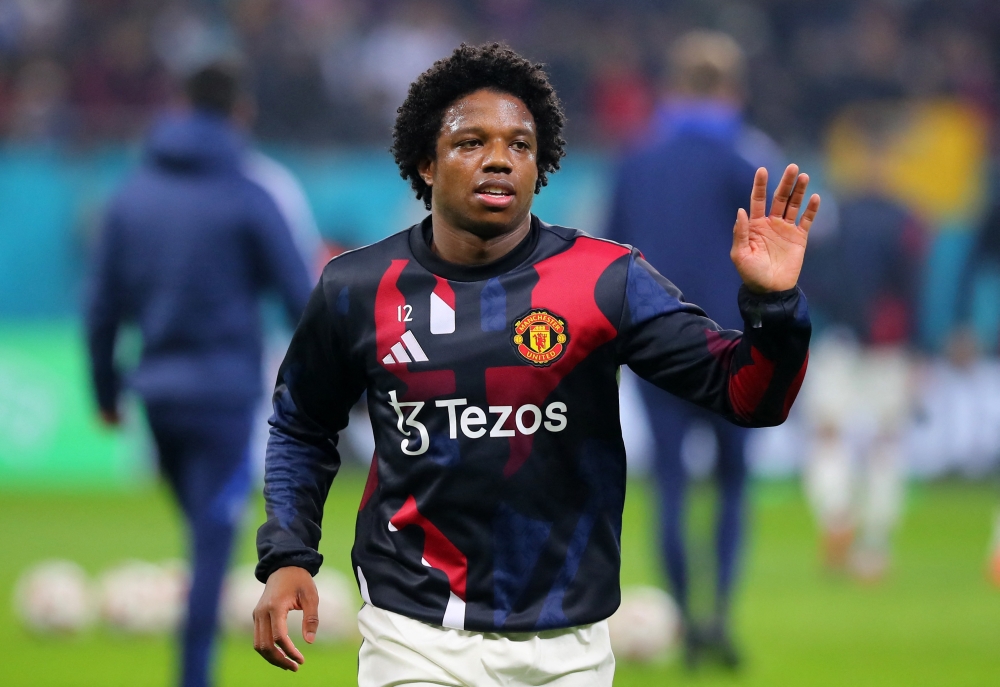 Manchester United's Tyrell Malacia during the warm up before the match with FCSB. — Reuters pic