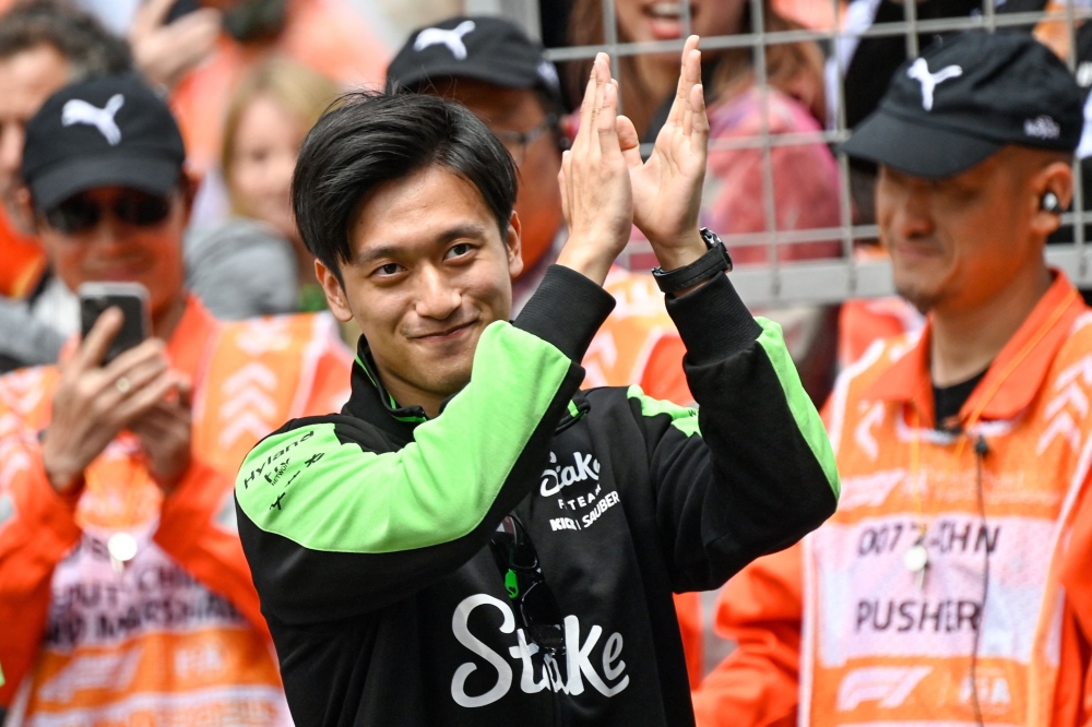Kick Sauber's Chinese driver Zhou Guanyu arrives ahead of the Formula One Chinese Grand Prix race at the Shanghai International Circuit in Shanghai on April 21, 2024. — AFP pic