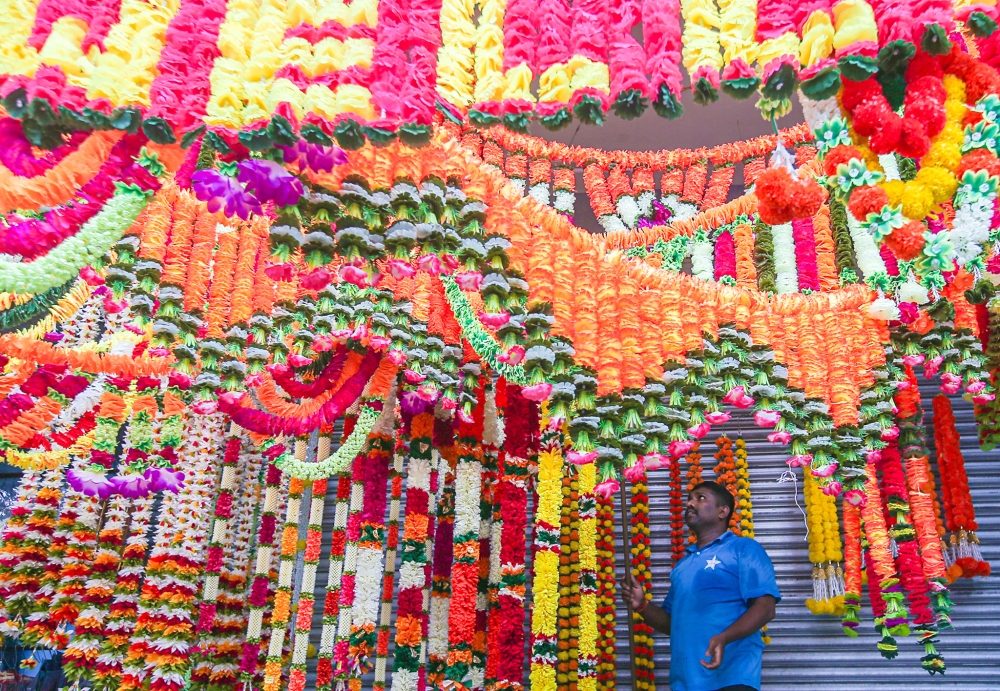 Shops at Little India in Ipoh decorated with artificial flower garlands ahead of Deepavali celebrations in this file picture dated November 3, 2023. — File picture by Farhan Najib