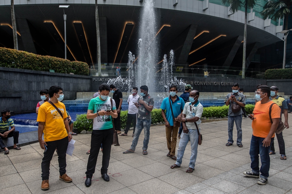 The park outside the Kuala Lumpur Convention Centre is a popular relaxation spot that also attracts many foreign workers, especially during their days off on weekends. — Picture by Firdaus Latif