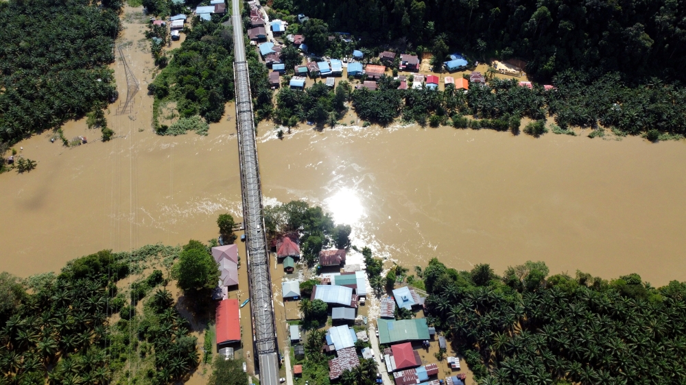 An aerial view shows flood waters inundating Kampung Mengaris 1, located on the banks of the Kinabatangan River on February 6, 2025. — Bernama pic