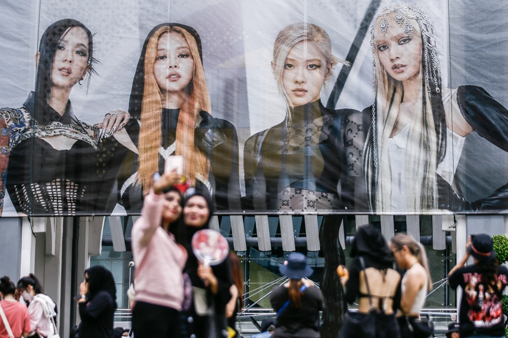 Fans of popular girls group Blackpink pose for pictures before the group’s concert at the Bukit Jalil Stadium in this file photo taken on March 4, 2023. — Picture by Hari Anggara