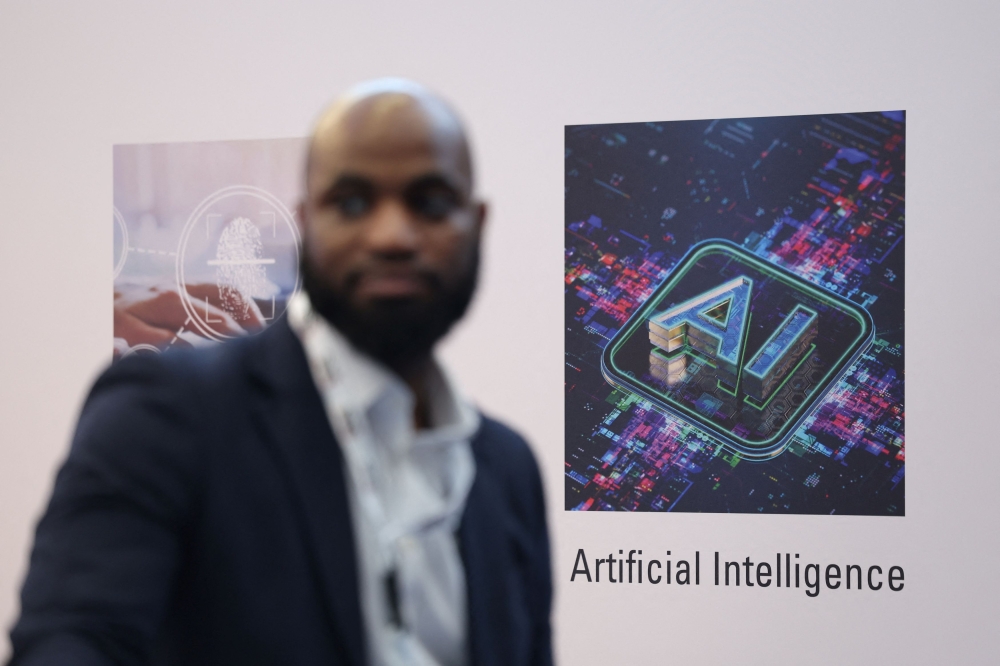 A person walks past a message reading ‘Artificial Intelligence’, during the AI & Big Data Expo 2025 at the Olympia, in London February 5, 2025. — Reuters pic  