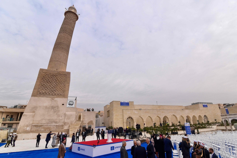 Attendees arrive for a Unesco ceremony celebrating the final phases of restoration work on heritage monuments in old Mosul on February 5, 2025, as part of ongoing reconstruction projects in the city that was damaged during the fight with the Islamic State (IS) group. — AFP pic