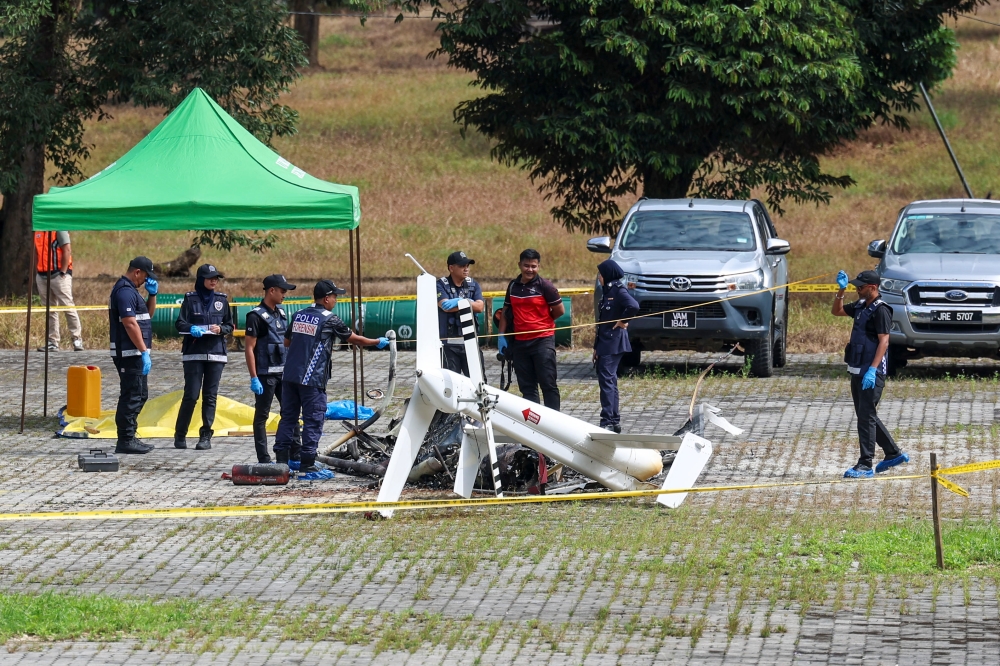 The PDRM Forensic Unit is seen at the site of a Bell 206L4 helicopter crash in Bentong February 6, 2025. — Bernama pic
