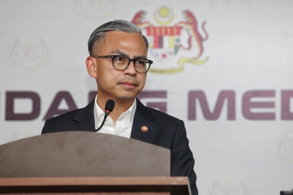 Communications Minister Fahmi Fadzil listens to a question during his weekly post-Cabinet press briefing at the Communications Ministry in Putrajaya February 7, 2025. — Picture by Choo Choy May
