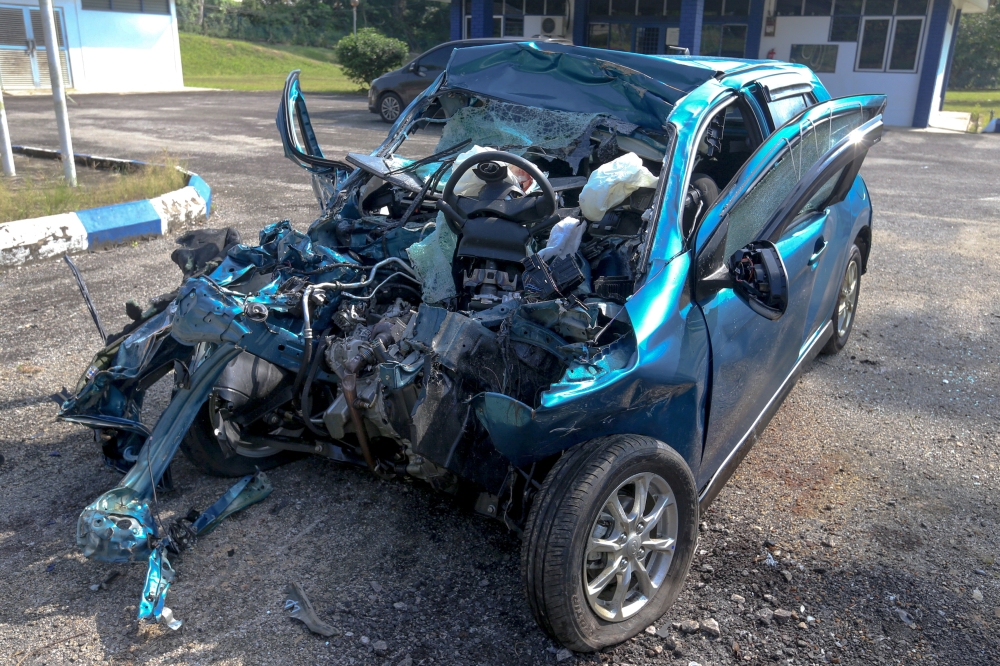 A Perodua Axia involved in a fatal three-vehicle crash with a five-tonne truck on Jalan Kuala Krai-Gua Musang, leaving two dead and two seriously injured on February 8, 2025. — Bernama pic