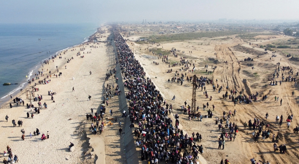 A drone view shows Palestinians displaced to the south at Israel's order during the war, making their way back to their homes in northern Gaza, amid a ceasefire — Pic by Reuters