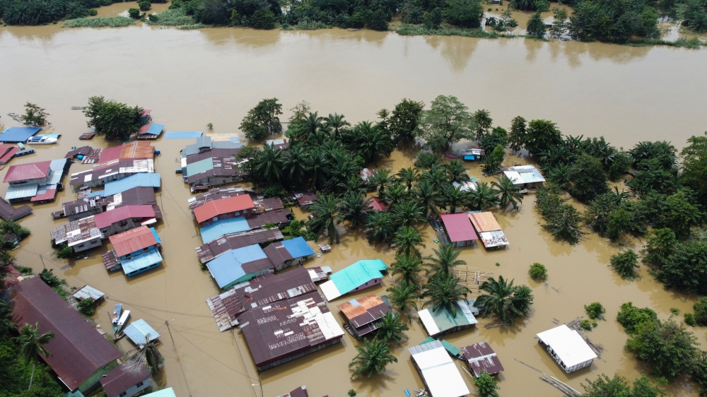 A flooded Pangkalan Bukit Garam in Kinabatangan on February 4, 2025. At the time of writing, 275 people remain in temporary relief centres in the district. — Bernama pic