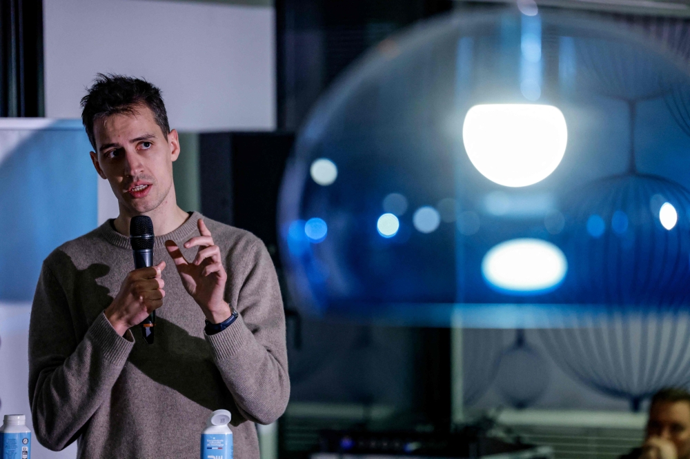 French founder of artificial intelligence start-up Mistral AI, Arthur Mensch speaks during a visit at the French national employment agency France Travail in Paris on February 4, 2025. — AFP pic
