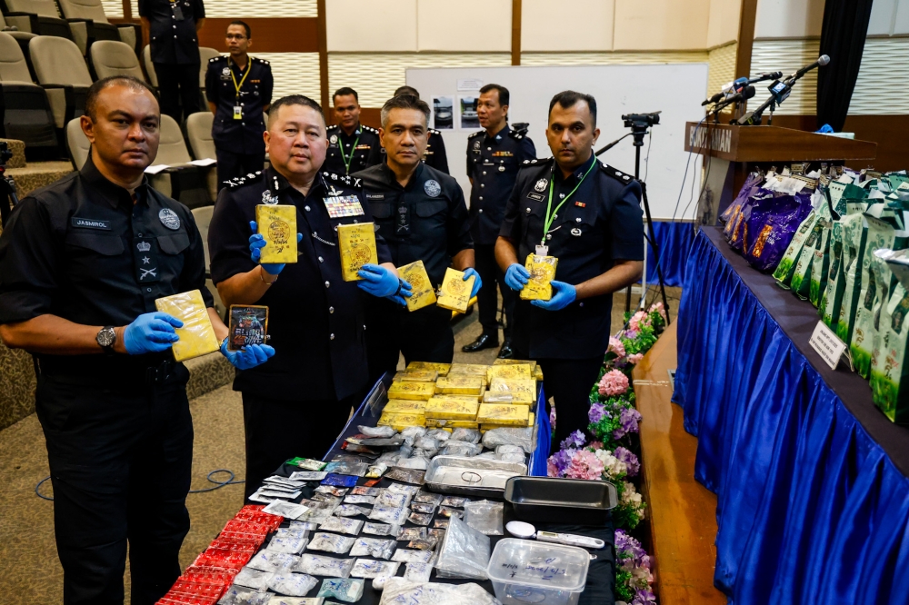 Bukit Aman Narcotics Criminal Investigation Department director Datuk Seri Khaw Kok Chin with the seized drugs during a press conference at the Bukit Aman police headquarters in Kuala Lumpur, February 10, 2025. — Picture by Firdaus Latif