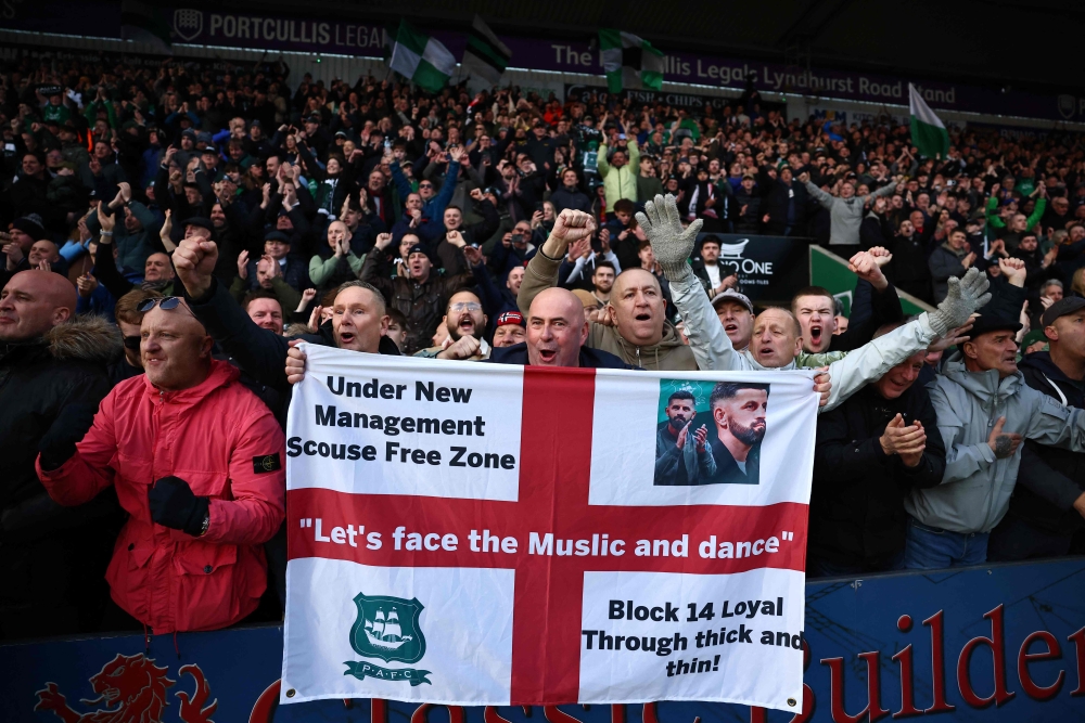 Fans celebrate following the English FA Cup fourth round football match between Plymouth Argyle and Liverpool at Home Park in Plymouth, south west England, on February 9, 2025. — AFP pic