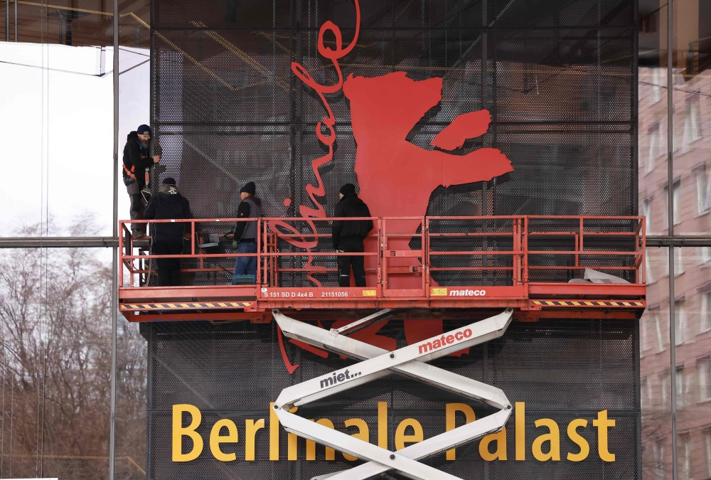 Workers mount the Berlinale bear on the facade of the Berlinale Palace the festival's main venue as preparations for the Berlin International Film Festival Berlinale are under way in Berlin, on February 7, 2025. — AFP pic
