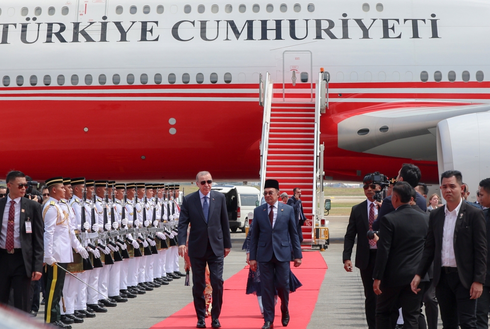 Prime Minister Datuk Seri Anwar Ibrahim accompanies Turkish President Recep Tayyip Erdogan, who arrived in Malaysia for a two-day official visit, as they inspect a guard of honour from the First Battalion of the Royal Ranger Regiment (Ceremonial) at the Bunga Raya Complex of Kuala Lumpur International Airport (KLIA), February 10, 2025. — Bernama pic 
