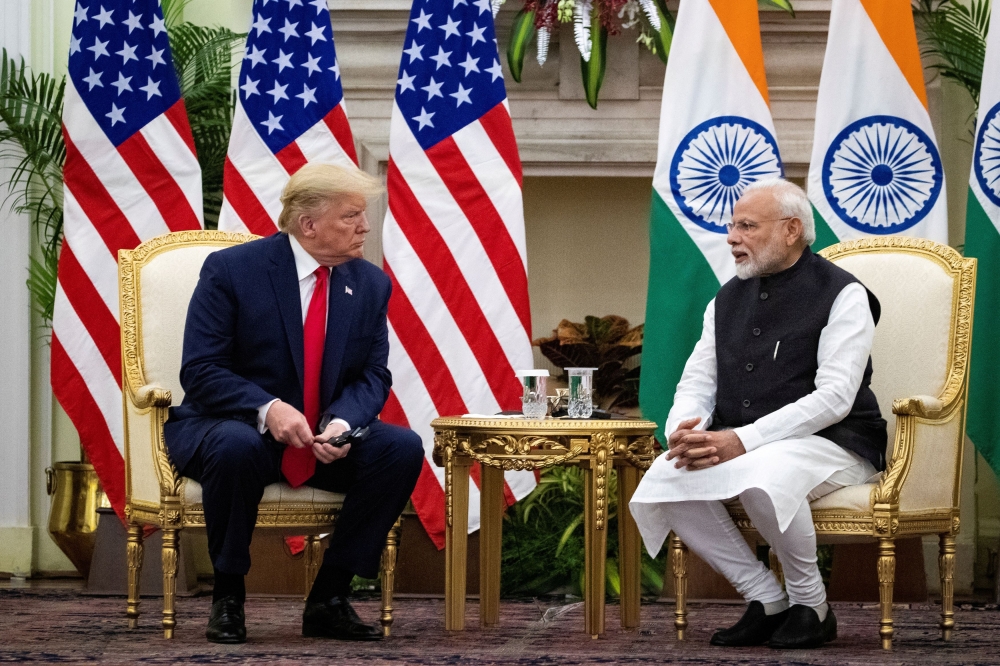 Indian Prime Minister Narendra Modi speaks to US President Donald Trump during a meeting at Hyderabad House in New Delhi in this file photo taken on February 25, 2020. Modi is preparing additional tariff cuts ahead of a meeting this week with Trump that could boost American exports to India and avoid a potential trade war, government officials said. — Reuters pic  
