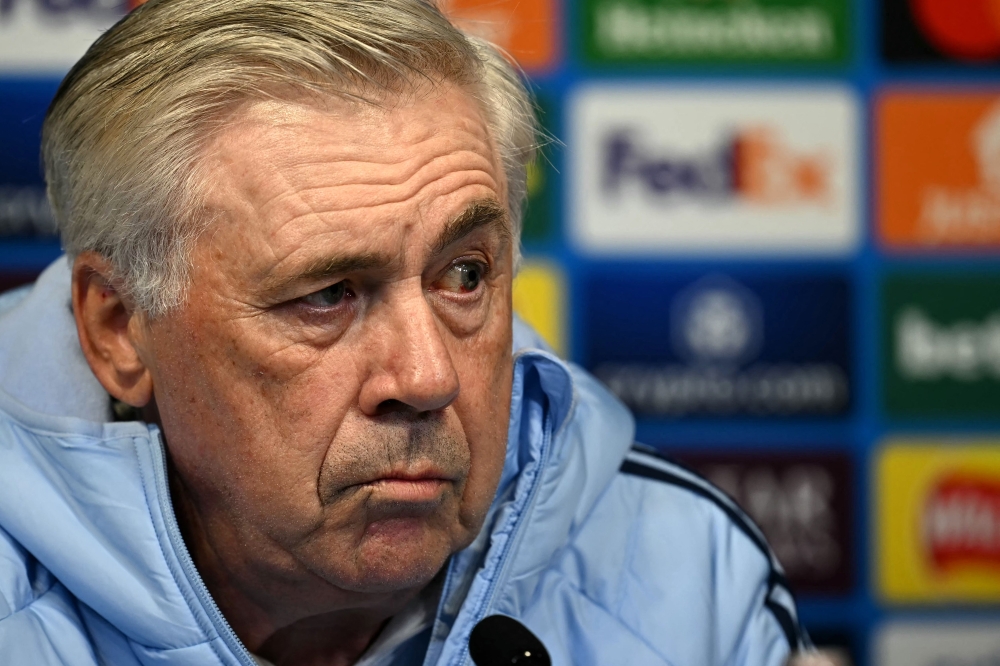 Real Madrid's Italian coach Carlo Ancelotti looks on during a press conference at the Ethiad Stadium in Manchester on the eve of their Uefa Champions League football match against Manchester City. — AFP pic