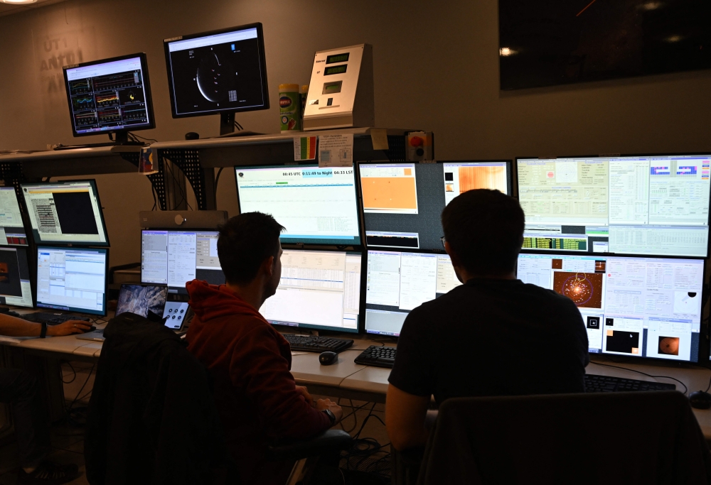 Astronomers work at the European Southern Observatory's (ESO) Paranal Observatory on Paranal Hill in Chile's Antofagasta Region, in the Atacama Desert some 1150 km north of Santiago, on January 27, 2025. A project to develop green hydrogen near the Cerro Paranal observatory, home to the world's most powerful optical observatory, threatens the world's darkest and most pristine skies. — AFP pic 