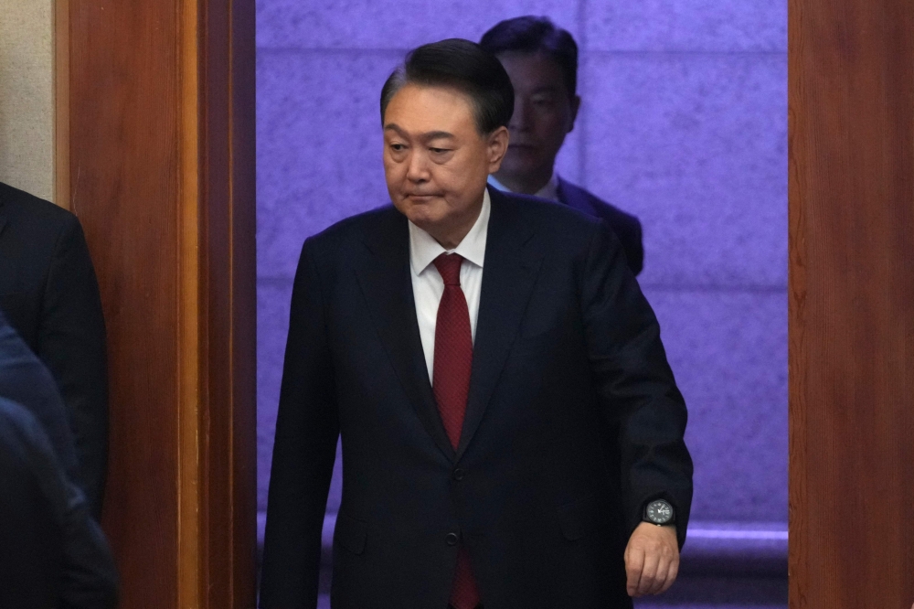 South Korea's impeached President Yoon Suk Yeol arrives to attend a hearing of his impeachment trial over his short-lived imposition of martial law at the Constitutional Court in Seoul on February 11, 2025. — Lee Jin-man/Pool/AFP pic 