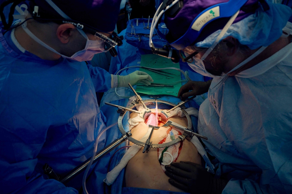 A team of surgeons perform a kidney transplant in New York, US on July 14, 2023. — AFP pic
