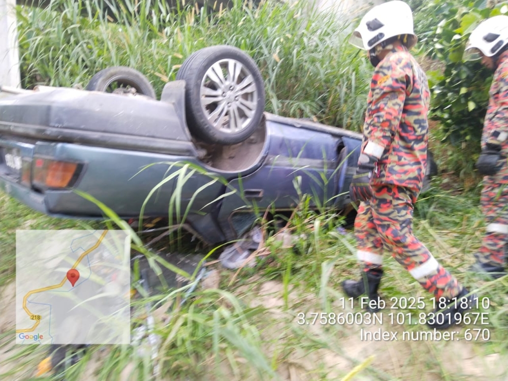 Rescue personnel are pictured at the accident scene. — Picture via Facebook