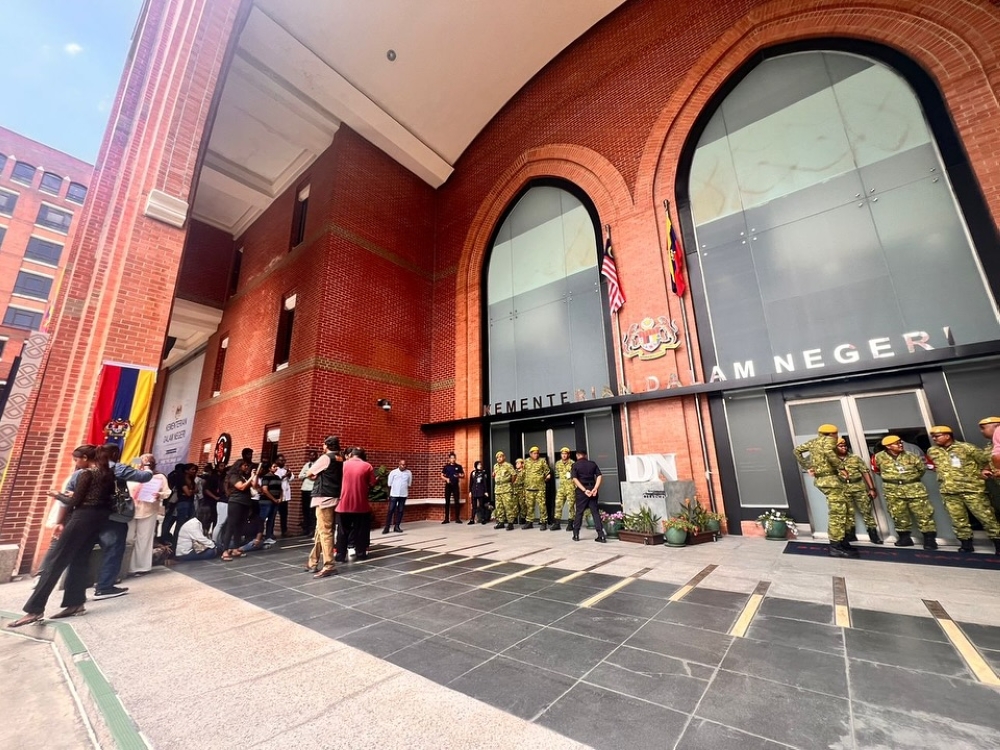 Security personnel guard the entrance to the Home Ministry building in Putrajaya on Feb 10, 2025. — Picture from Facebook/Suaram