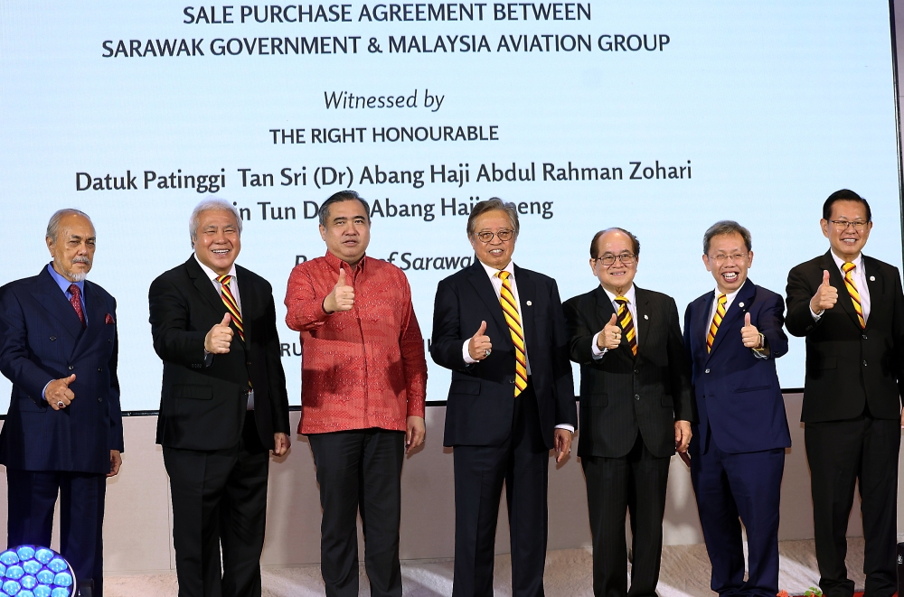 The Sarawak government yesterday signed a sales and purchase agreement with Malaysia Aviation Group (MAG), finalising the acquisition of MASwings, now rebranded as AirBorneo. — Bernama pic