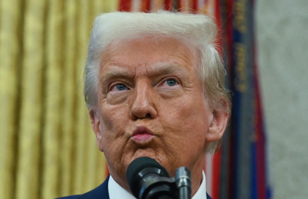 In his first three weeks in office, Trump has issued a flurry of executive orders aimed at slashing US federal spending, that critics have widely denounced as unconstitutional. — AFP pic