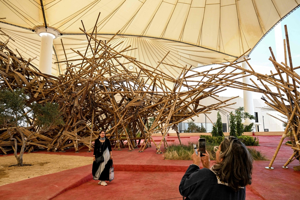The second edition of the Islamic Arts Biennale, titled And All That Is In Between, features as its centrepiece segments of the ‘kiswa’, the black cloth embroidered with gold and silver that covers the Kaaba, the cubic building towards which all Muslims pray. — Pic by AFP