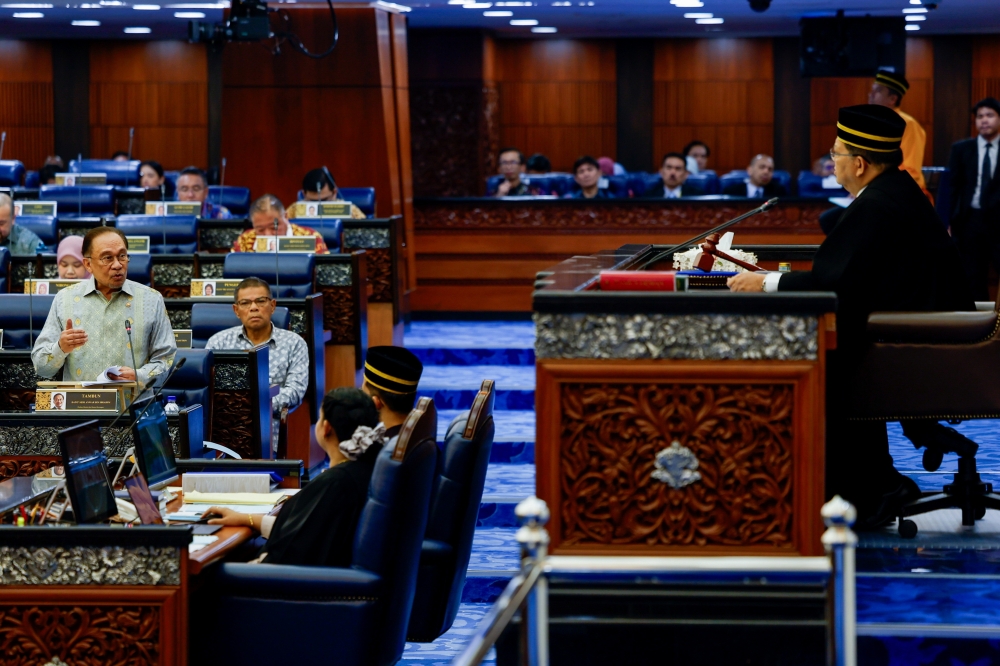 Prime Minister Datuk Seri Anwar Ibrahim speaks during the Prime Minister’s Question Time in the Dewan on Feb 13, 2025. — Bernama pic