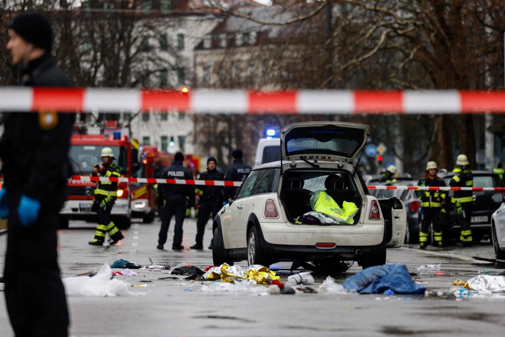Members of the emergency services work at the scene where a car drove into a crowd in the southern German city of Munich on February 13, 2025. — AFP pic