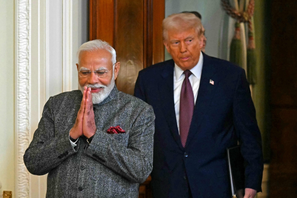 Donald Trump and Narendra Modi at a joint press conference in the East Room of the White House. — Pic by AFP