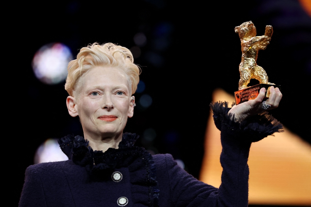 Scottish actress Tilda Swinton poses on stage after having been presented with the Honorary Bear of the Berlinale during the opening ceremony ahead of the screening of the film ‘Das Licht’ (The light) in the ‘Berlinale special’ section of the 75th Berlinale, Europe’s first major film festival of the year, in Berlin February 13, 2025. — AFP pic