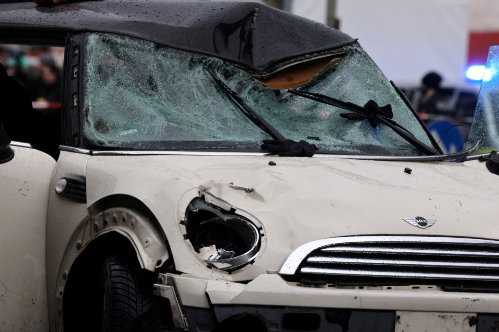 The damaged windscreen of a car is pictured after it drove into a crowd in Munich, Germany, February 13, 2025, injuring several people. — Reuters pic