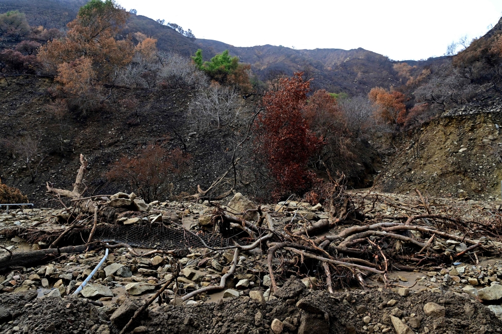 Mud and boulders cover a road near the Palisades Fire zone, in the aftermath of a storm in the Pacific Palisades neighborhood of Los Angeles. — Pic by AFP